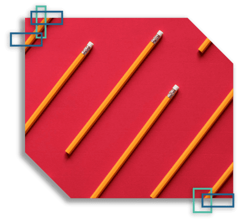 Stacked pencils against a red background.